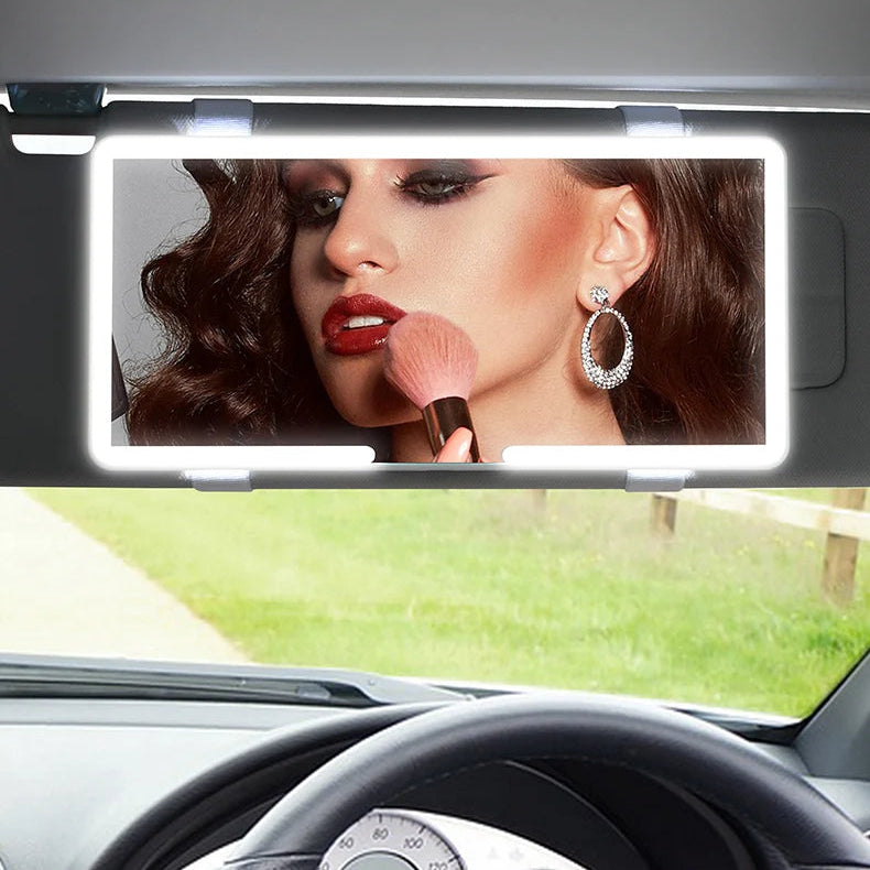 Car LED beauty mirror with a woman applying makeup, displayed in a car interior.